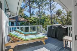 Palm-surrounded abode with screened-in balcony, chef's kitchen, smart TVs, & W/D - Image 3