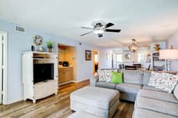 Riverfront condo with pool, 2 tennis courts, & screened porch - near beach - Image 2