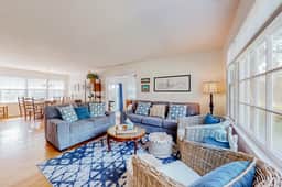 Refined coastal home surrounded by palms with large deck & athletic court access - Image 2