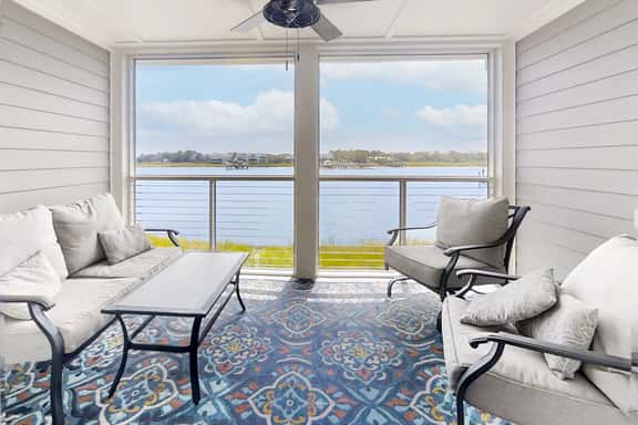 Newly renovated two-story waterfront condo with screened porch, pool, & tennis - Image 1