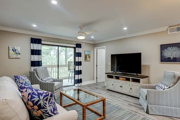 Fully updated condo with serene view, enclosed balcony, WiFi, W/D, pool, & gym - Image 1