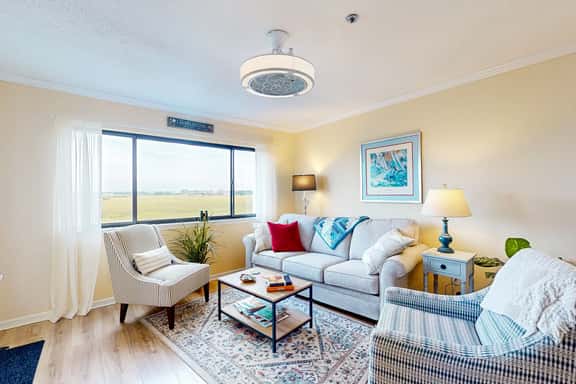 Marsh-view condo with on-site pool, tennis, & private balcony - Image 1