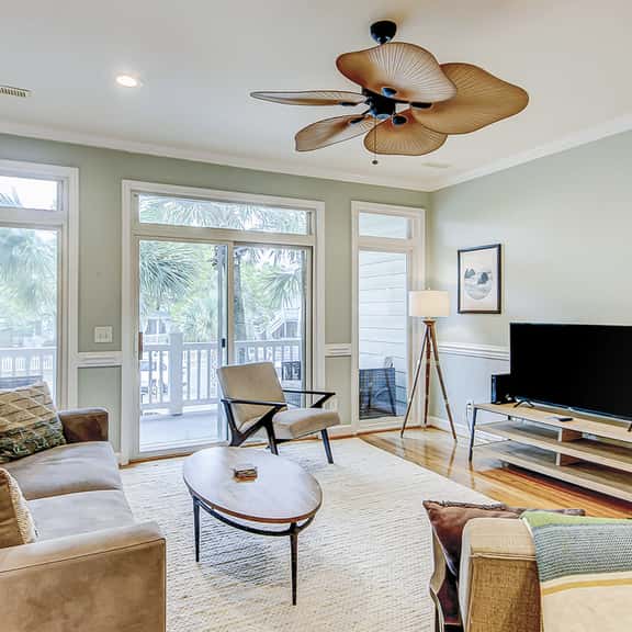 Beachy, three-story villa w/ deck & shared pool - walk downtown & to the beach - Image 1