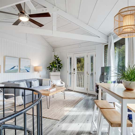 Lakefront home with lagoon view, deck & AC - close to beach, golf, & pools - Image 1