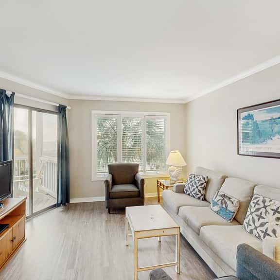 Second-floor villa with lovely ocean views, pickleball, pool & screened deck - Image 1