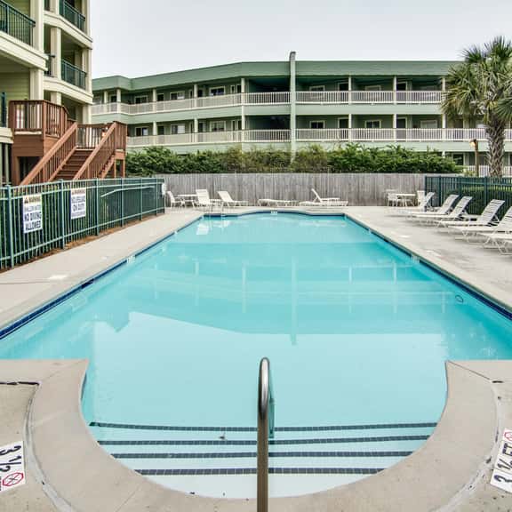 Beachfront villa w/ ocean views, private deck, pool access – steps from beach - Image 1