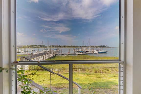 1st-floor riverfront condo w/spectacular river views, balcony, and central AC