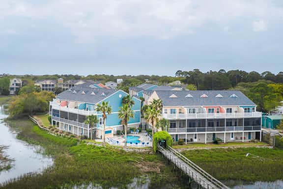 Beachy, three-story villa w/ deck & shared pool - walk downtown & to the beach