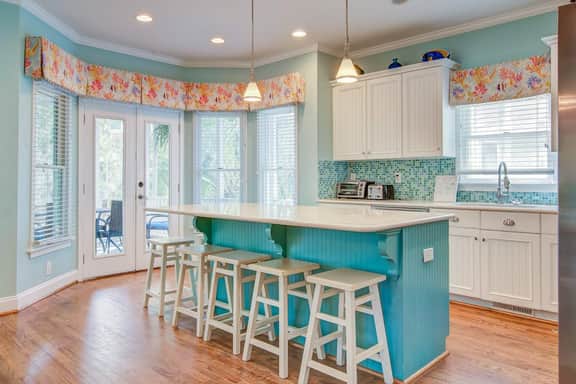 Elegant home on the boardwalk with 2 balconies & shared pools - walk to beach