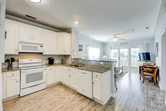 Fantastic condo with water-view, pool, balcony, central AC, & washer/dryer
