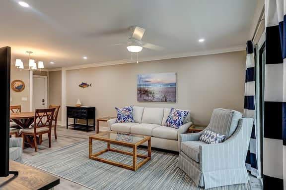 Fully updated condo with serene view, enclosed balcony, WiFi, W/D, pool, & gym