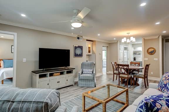 Fully updated condo with serene view, enclosed balcony, WiFi, W/D, pool, & gym