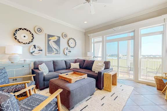 Inviting waterfront townhouse with beach access, balcony, W/D, pool & dock