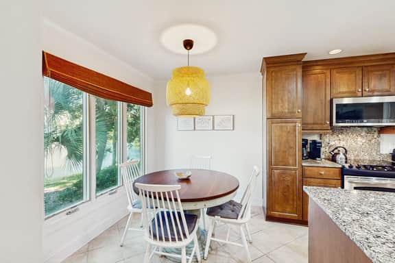 Lagoon-Front Villa w/ Screened Porch, WiFi & AC - Steps to Beach, Tennis & Golf