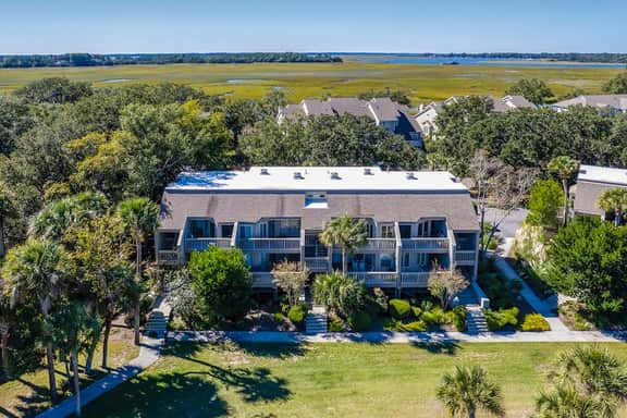 Lovely condo near beach with enclosed porch, pool, tennis, and golf access