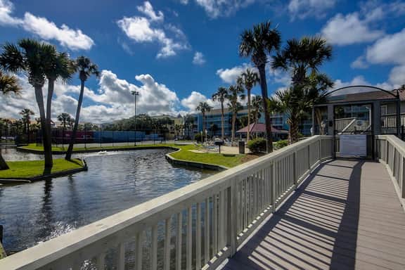 Newly renovated two-story waterfront condo with screened porch, pool, & tennis