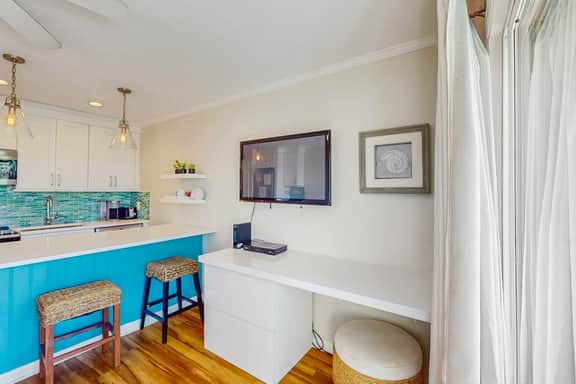 Oceanfront condo with water views, pool, balcony, & easy beach access