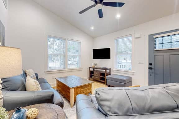 Renovated charmer with chef's kitchen, front porch, work desk, AC, & firepit