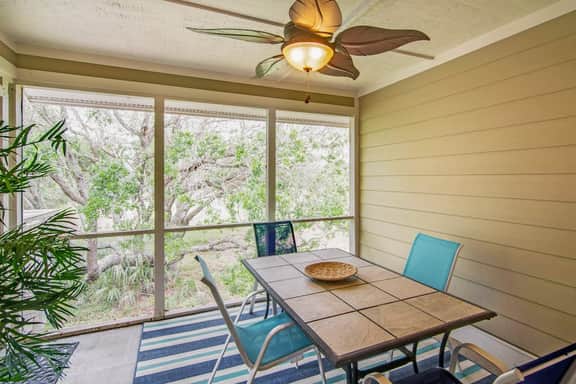Renovated townhome next to golf course w/ community pool access- close to beach
