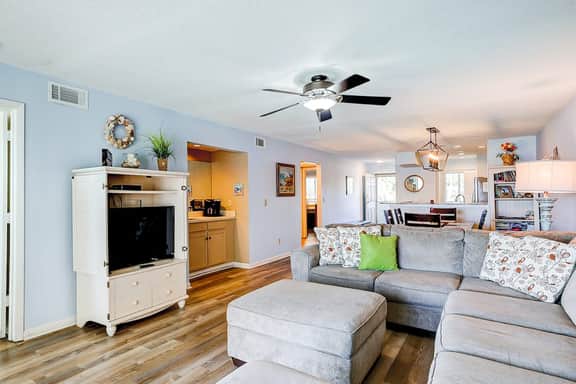 Riverfront condo with pool, 2 tennis courts, & screened porch - near beach