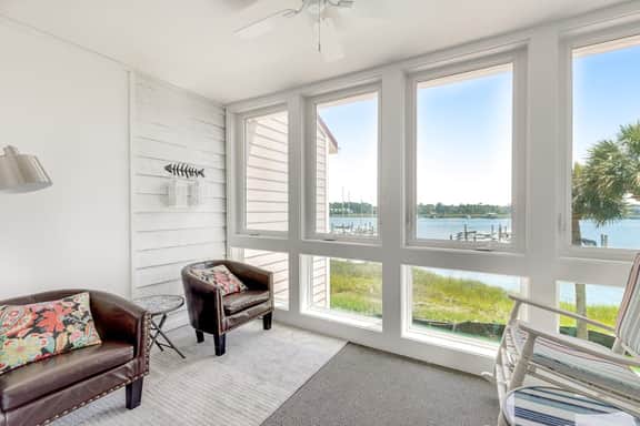 Second-floor villa w/ river views & community pool, tennis courts, and dock