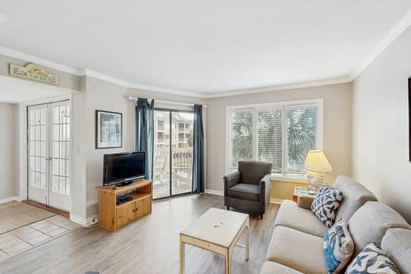 Second-floor villa with lovely ocean views, pickleball, pool & screened deck