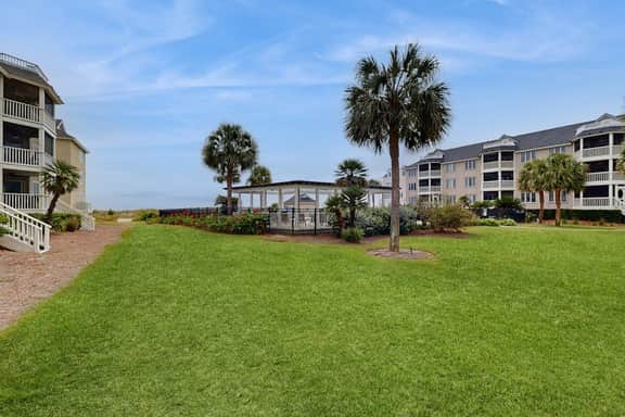 Second-floor villa with lovely ocean views, pickleball, pool & screened deck