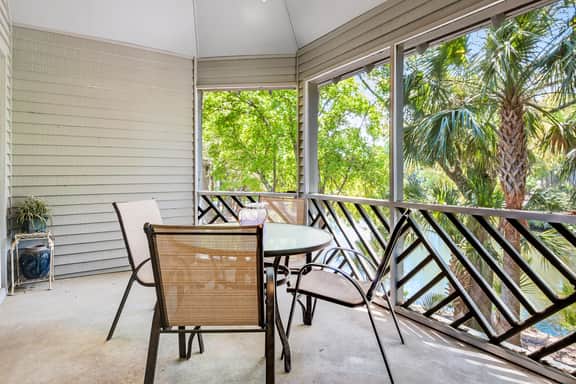 Lagoon view, second floor villa w/ screened in porch, short walk to the beach - Image 2
