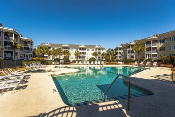 Second-floor villa with lovely ocean views, pickleball, pool & screened deck - Image 2