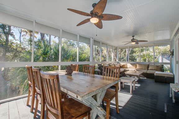 Palm-surrounded abode with screened-in balcony, chef's kitchen, smart TVs, & W/D - Image 2