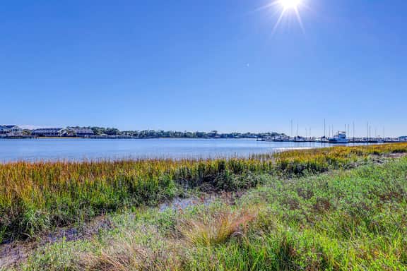 Riverfront condo with pool, 2 tennis courts, & screened porch - near beach - Image 4