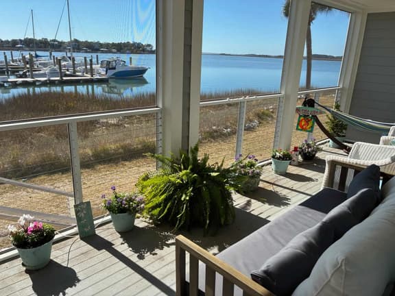 1st-floor riverfront condo w/spectacular river views, balcony, and central AC