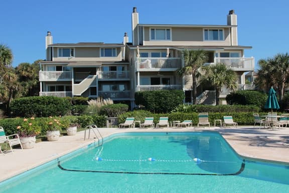 Beautiful villa surrounded by lush landscaping - walk to beach, golf & pool