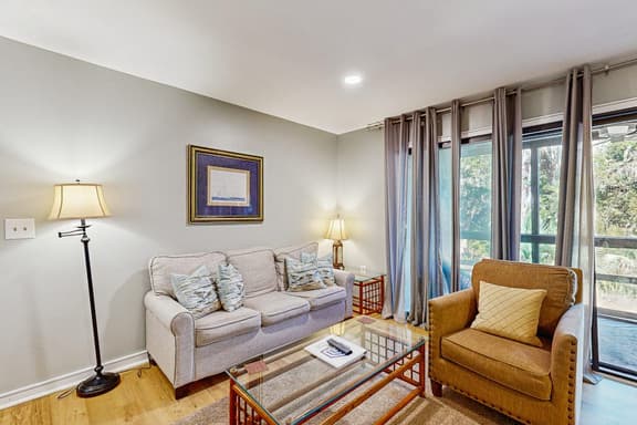 Renovated lagoon-view condo with screened porch & WiFi - steps from the beach