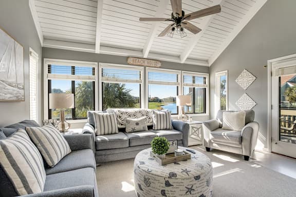 Stylish beach villa with three decks, and golf course views