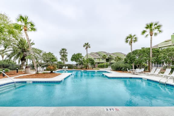Three-story ocean-view villa with pool, balcony, charcoal grill, & central AC